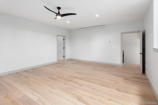 empty room featuring light hardwood / wood-style flooring and ceiling fan