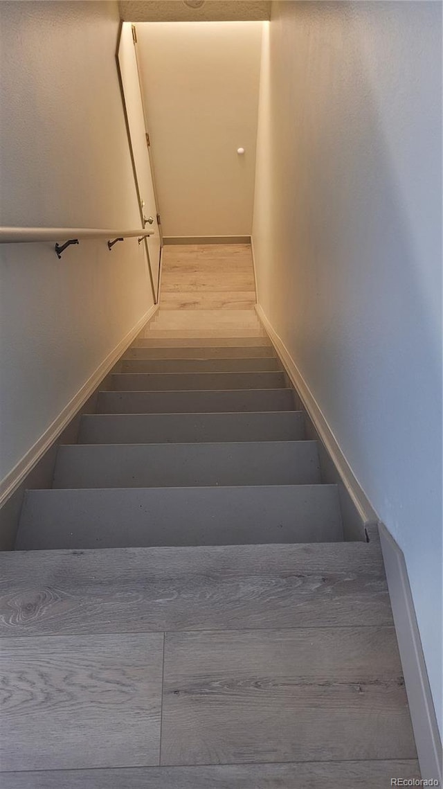 1818 S Quebec Way Unit 5-7, Denver, CO 80231 - staircase featuring wood finished floors