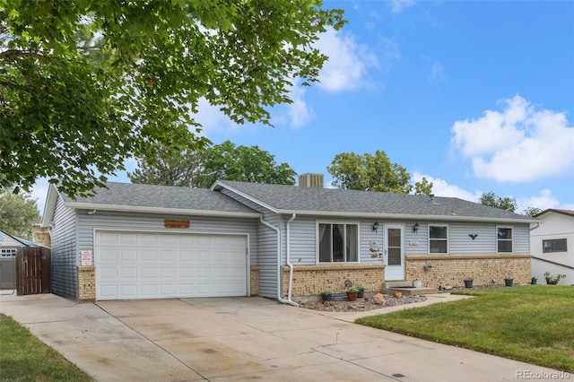 6651 S Dudley Ct, Littleton, CO 80123 - single story home featuring brick siding, concrete driveway, an attached garage, a front lawn, and a shingled roof
