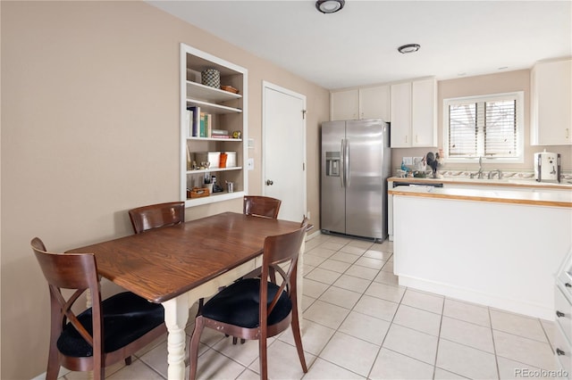 dining room with light tile patterned flooring and built in features