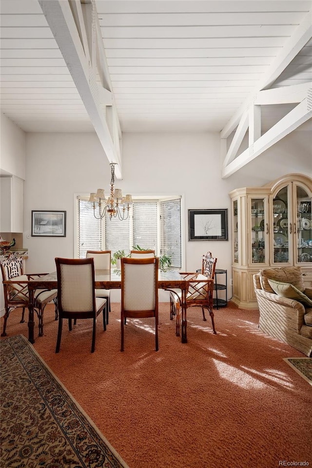 carpeted dining room with an inviting chandelier