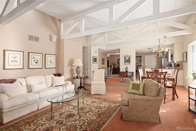 living area with high vaulted ceiling, light colored carpet, visible vents, a chandelier, and beamed ceiling