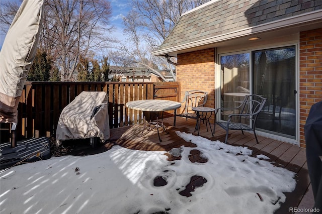 view of snow covered deck