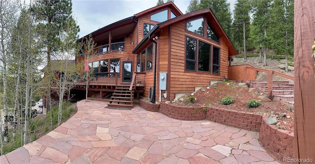 4618 SE Summit Trl, Evergreen, CO 80439 - view of front of home with a patio, a deck, and a balcony