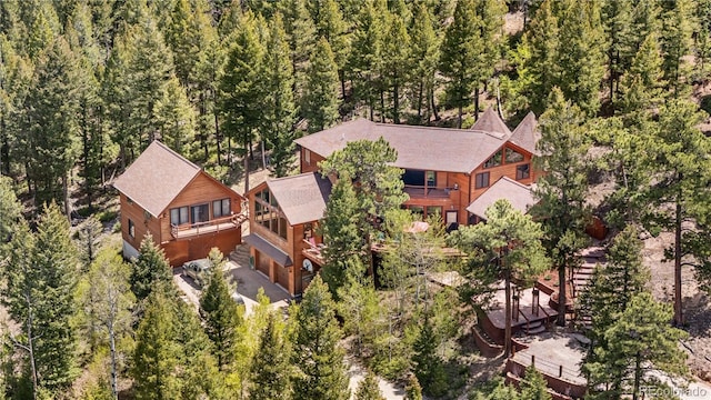 4618 SE Summit Trl, Evergreen, CO 80439 - aerial view of property and surrounding area featuring a heavily wooded area