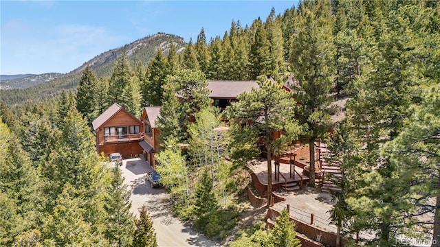 4618 SE Summit Trl, Evergreen, CO 80439 - mountain view featuring a forest