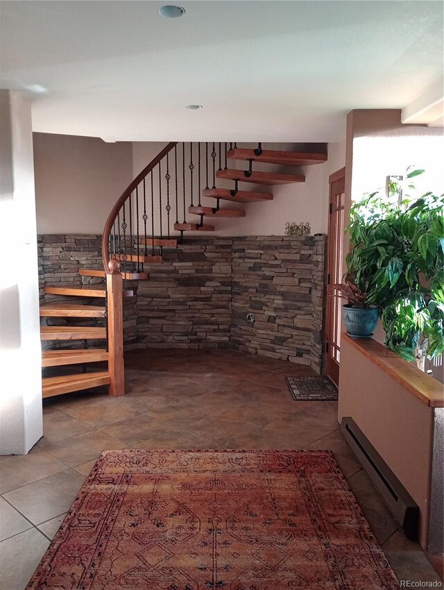 4618 SE Summit Trl, Evergreen, CO 80439 - stairway featuring a baseboard radiator