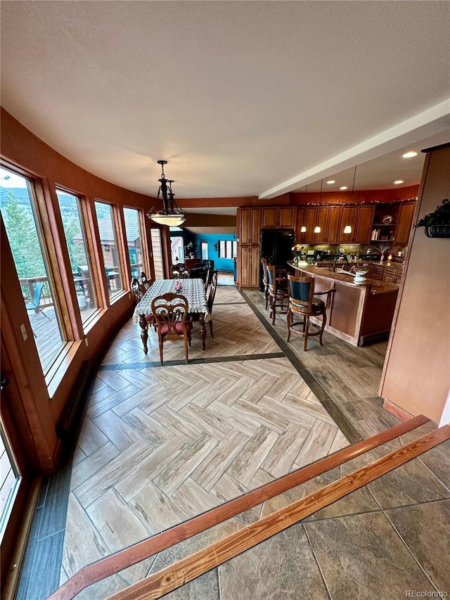 4618 SE Summit Trl, Evergreen, CO 80439 - dining room with healthy amount of natural light, recessed lighting, and a textured ceiling