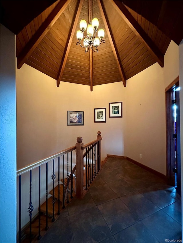 4618 SE Summit Trl, Evergreen, CO 80439 - staircase with wooden ceiling with exposed beams, a chandelier, and tile patterned floors