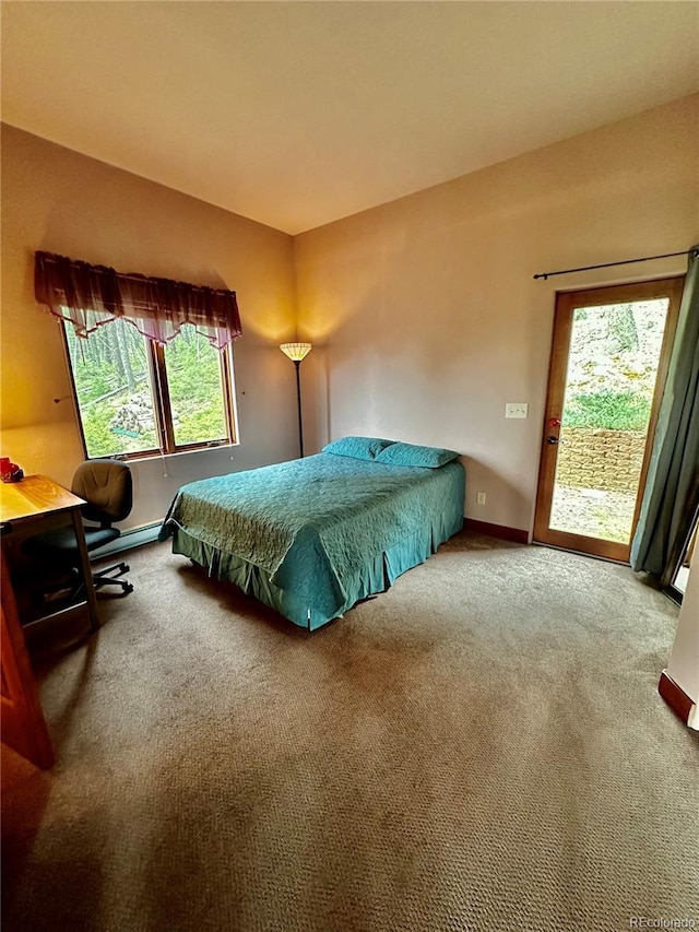 4618 SE Summit Trl, Evergreen, CO 80439 - carpeted bedroom featuring access to outside and baseboards
