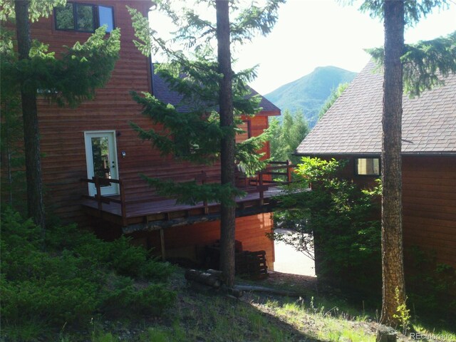 4618 SE Summit Trl, Evergreen, CO 80439 - view of side of property with a mountain view and roof with shingles