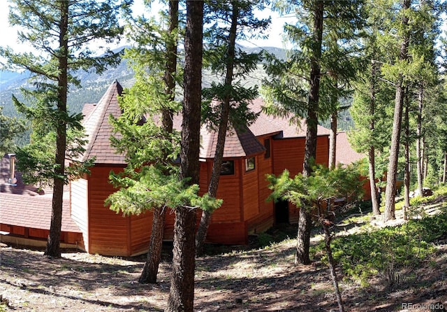 4618 SE Summit Trl, Evergreen, CO 80439 - view of side of property with roof with shingles and a mountain view