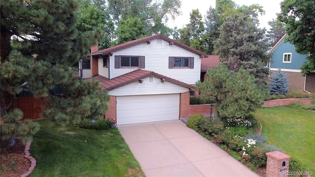 2141 S Dallas St, Denver, CO 80231 - view of front facade featuring an attached garage, concrete driveway, and brick siding