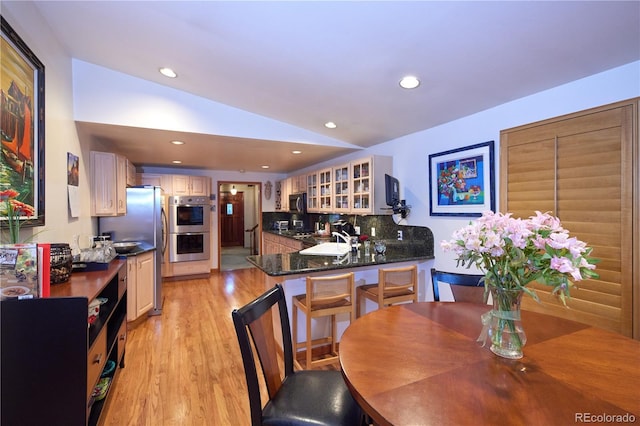 2141 S Dallas St, Denver, CO 80231 - dining area with lofted ceiling, light wood-style floors, and recessed lighting
