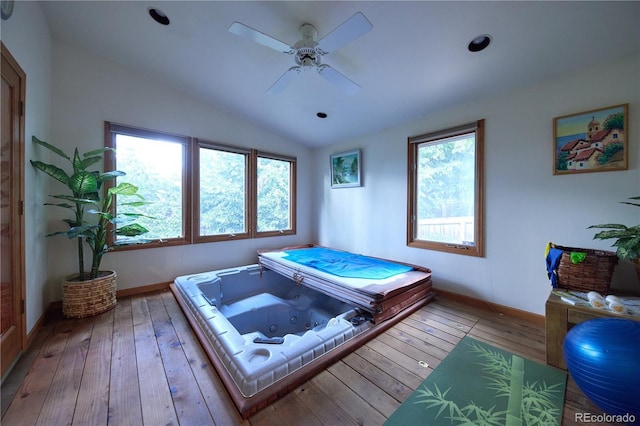 2141 S Dallas St, Denver, CO 80231 - full bathroom featuring plenty of natural light, a whirlpool tub, ceiling fan, wood-type flooring, and vaulted ceiling