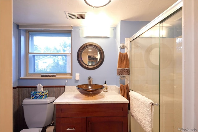 2141 S Dallas St, Denver, CO 80231 - bathroom featuring vanity, a stall shower, and a wainscoted wall