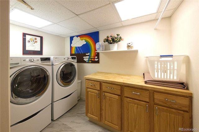 2141 S Dallas St, Denver, CO 80231 - washroom featuring light marble finish flooring and washing machine and dryer