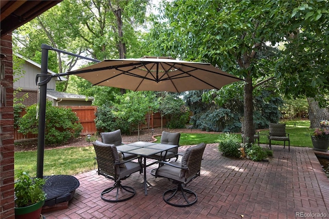 2141 S Dallas St, Denver, CO 80231 - fenced backyard with outdoor dining area and a patio area