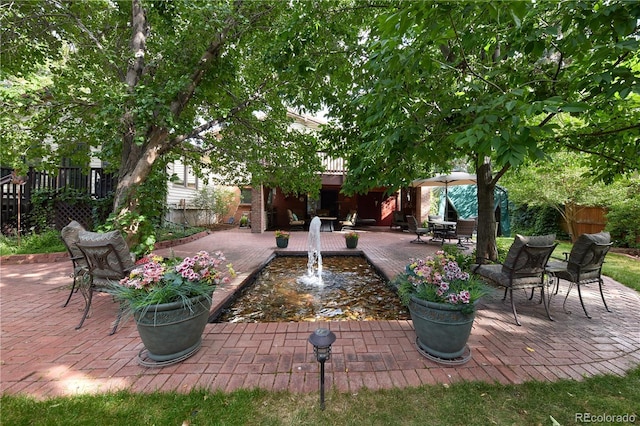 2141 S Dallas St, Denver, CO 80231 - fenced backyard featuring a patio