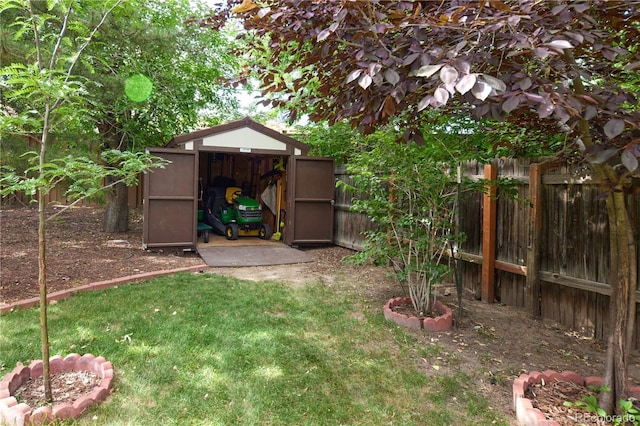 2141 S Dallas St, Denver, CO 80231 - fenced backyard featuring a storage unit