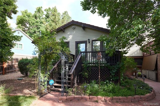 2141 S Dallas St, Denver, CO 80231 - back of house with stairs and a wooden deck