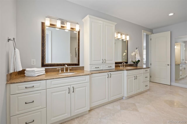 full bathroom featuring double vanity and recessed lighting