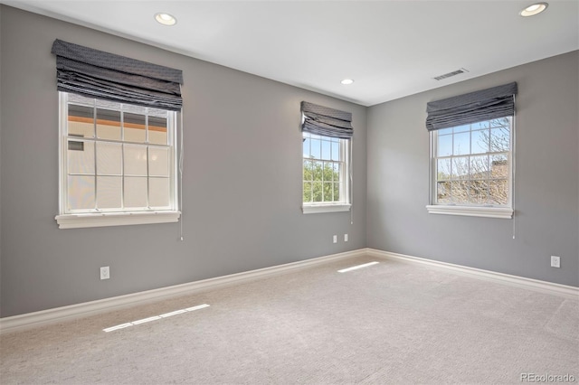 carpeted empty room with recessed lighting and baseboards