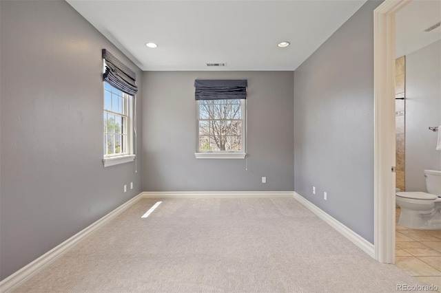 unfurnished room with carpet flooring, baseboards, and recessed lighting