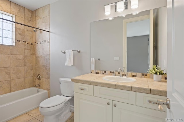 bathroom with toilet, vanity, shower / bathtub combination, and tile patterned floors