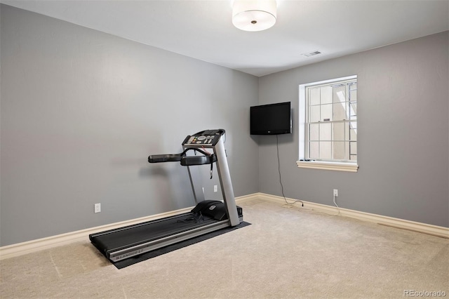 workout room with carpet flooring and baseboards