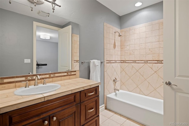 bathroom featuring shower / bath combination, tile patterned flooring, and vanity