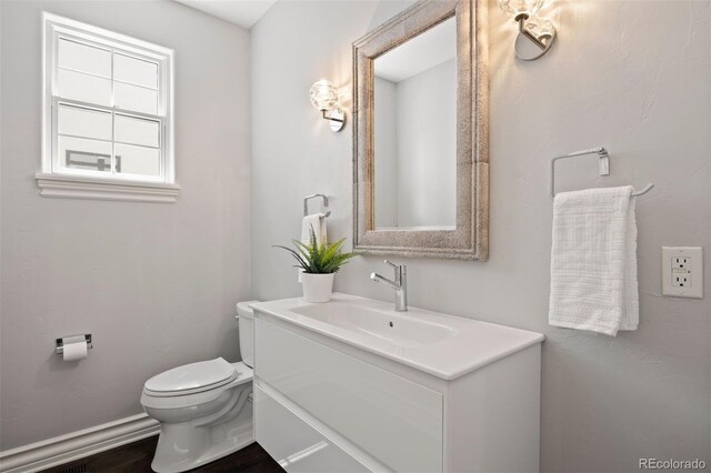 2500 S Monroe St, Denver, CO 80210 - half bath featuring vanity and toilet