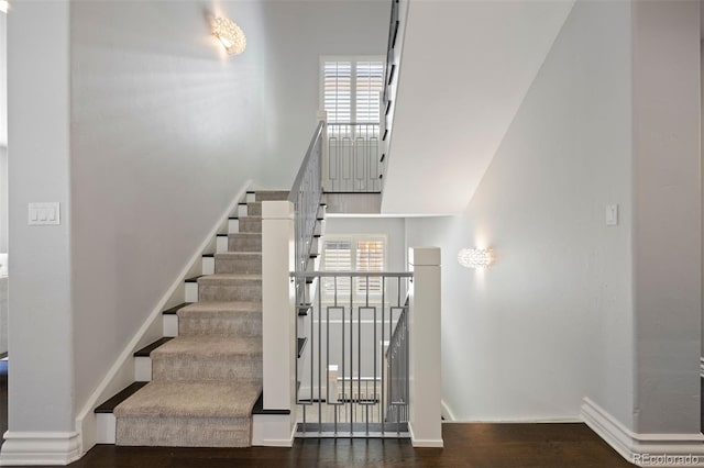 2500 S Monroe St, Denver, CO 80210 - stairway featuring healthy amount of natural light, wood finished floors, baseboards, and a towering ceiling