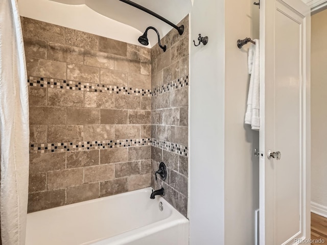 bathroom with shower / tub combo with curtain