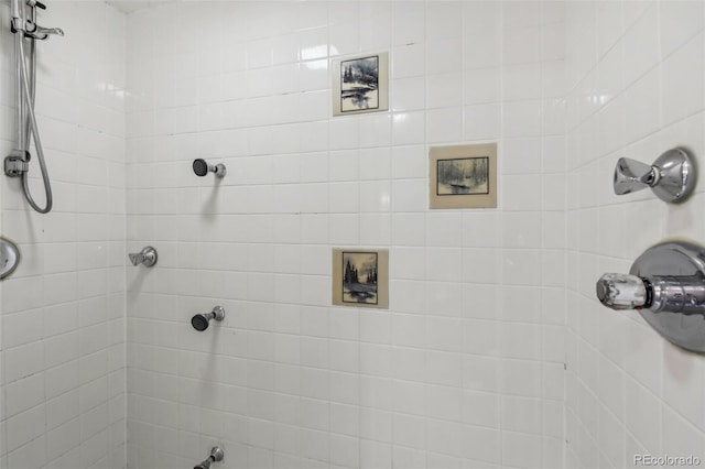 bathroom with a tile shower