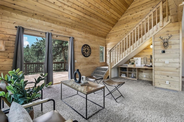 living room with carpet, stairs, vaulted ceiling, wood walls, and wooden ceiling