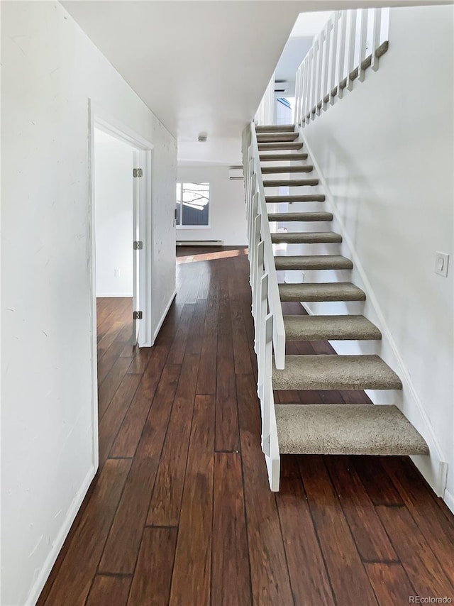 staircase featuring hardwood / wood-style flooring