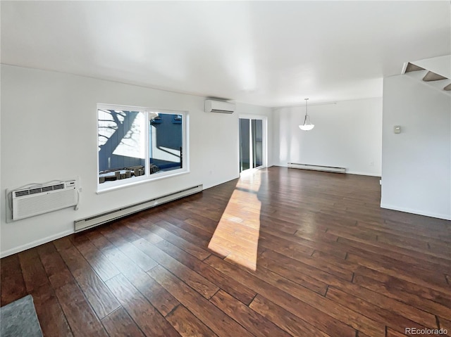 unfurnished room featuring a wall mounted air conditioner, dark hardwood / wood-style floors, and a baseboard heating unit