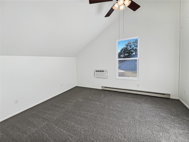 additional living space with ceiling fan, a baseboard heating unit, a wall unit AC, vaulted ceiling, and dark carpet