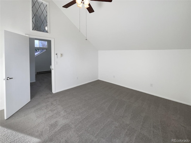 bonus room with a baseboard heating unit, ceiling fan, lofted ceiling, and dark colored carpet