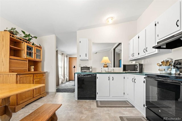 kitchen with under cabinet range hood, black appliances, a sink, and white cabinetry