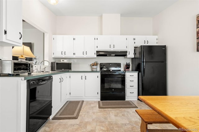 kitchen featuring black appliances, white cabinets, under cabinet range hood, and a sink