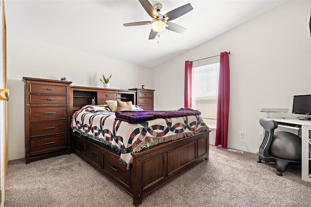 bedroom with light colored carpet, ceiling fan, and vaulted ceiling