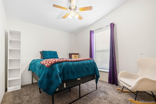 carpeted bedroom featuring a ceiling fan and vaulted ceiling