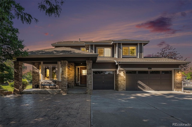 prairie-style home with a garage and concrete driveway