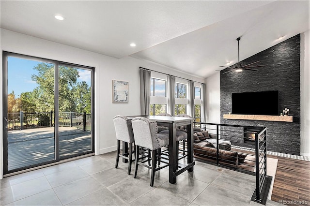 10731 E 151st Pl, Brighton, CO 80602 - dining area featuring baseboards, lofted ceiling, ceiling fan, recessed lighting, and a fireplace