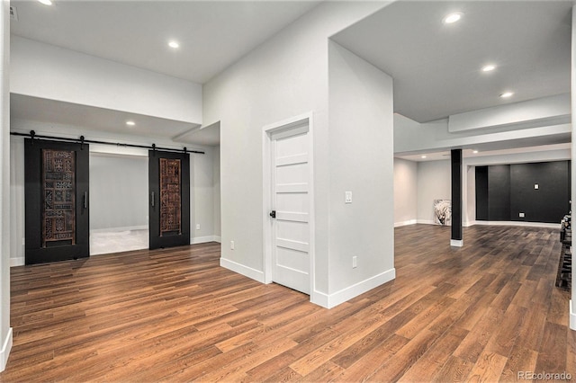 10731 E 151st Pl, Brighton, CO 80602 - below grade area featuring a barn door, wood finished floors, recessed lighting, and baseboards