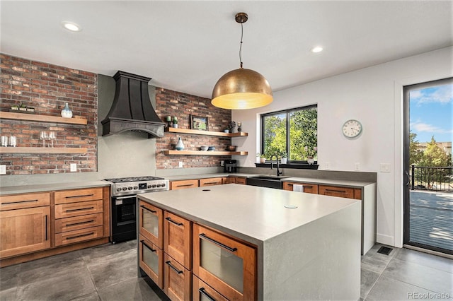 10731 E 151st Pl, Brighton, CO 80602 - kitchen featuring custom range hood, open shelves, gas range, a sink, and a center island