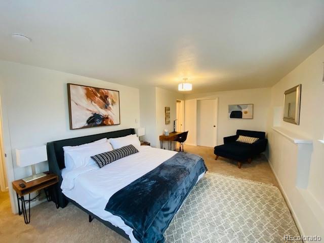 bedroom featuring light colored carpet
