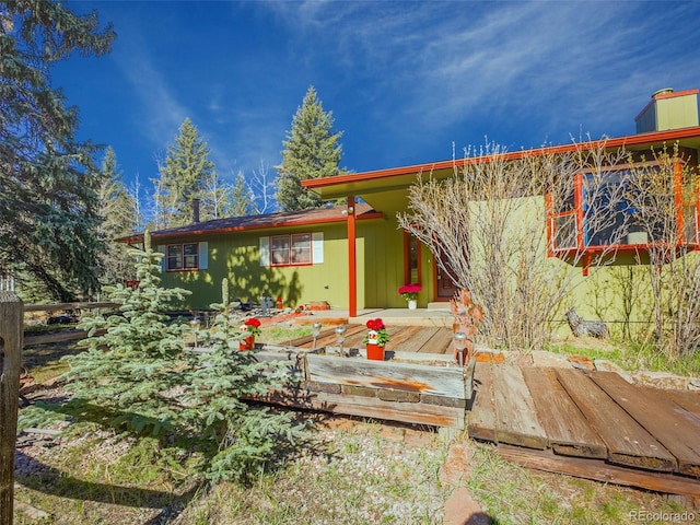 8473 Gray Fox Dr, Evergreen, CO 80439 - back of property featuring a deck